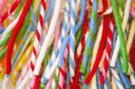 Vibrant wool tassels as a background image