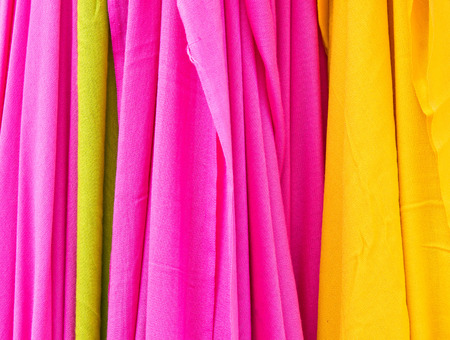 Selection of bright colorful cloths as a backgroundの写真素材