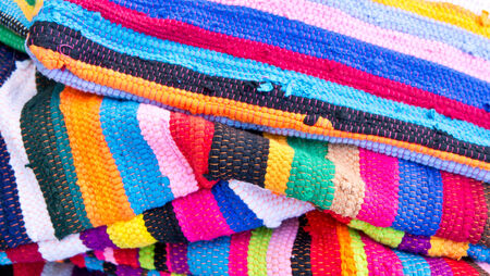 Colorful stripey textiles as a background, with shallow depth of fieldの写真素材