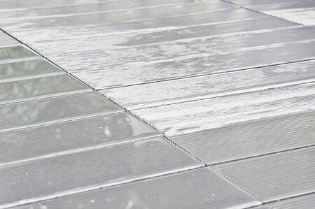 Wooden decking wet after rainfallの写真素材