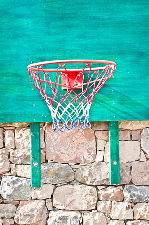 A basketball net on a green boardの写真素材