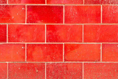 A weathered red tiled wall as a backgroundの写真素材
