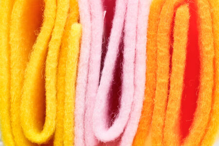 Pieces of pink,orange and yellow felt