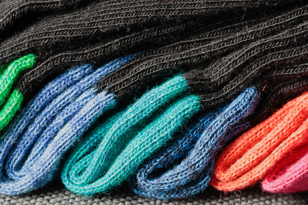 Set of colorful folded socks close up