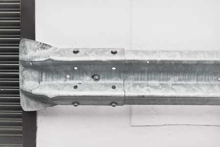 Part of a metal barrier to protect a wall from vehiclesの写真素材
