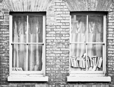 Piles of books in a house window