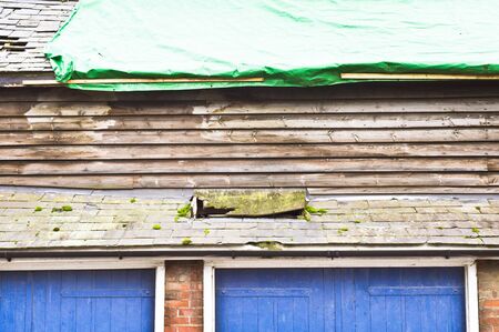 Repairs in progress to a barn roof