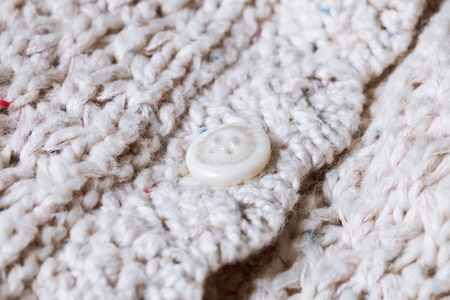 Close up of the button on a wool ladies' topの写真素材
