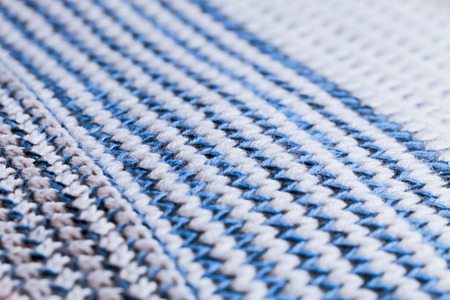 Blue and white striped pattern in a piece of wool knitwearの写真素材