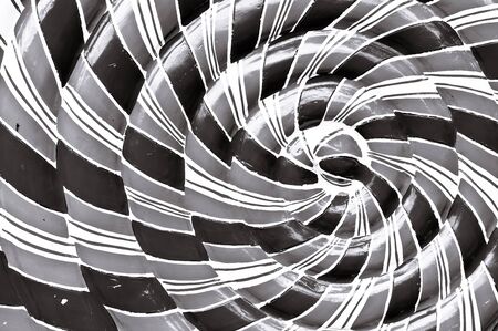 Abstract spiral pattern with red, white and green colours