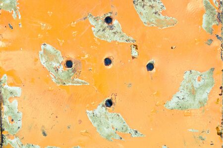 Rusty orange metal surface with water drops