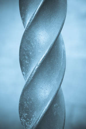 Close up of part of a metal spiral poleの写真素材
