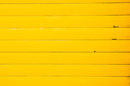 Part of a yellow metal sheet as a background imageの写真素材