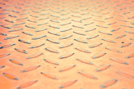 Red industrial metal sheet with shallow depth of fieldの写真素材