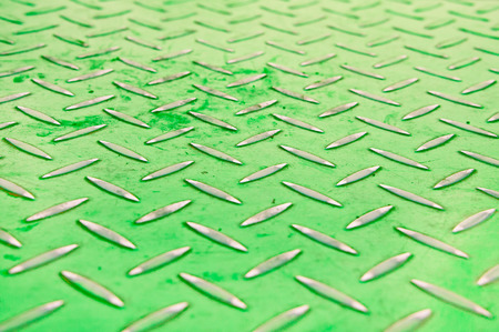 Green industrial metal sheet with shallow depth of fieldの写真素材