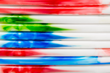 Colorful plastic tubs stacked as a background imageの写真素材