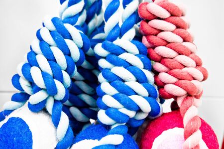 Red and blue rope toys close up as a background image