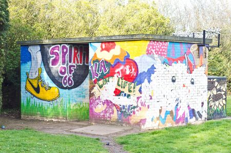 BURY ST EDMUNDS, UK - APRIL 11 2015: A colourful painted brick building in a park in Bury St EDmundsのeditorial素材