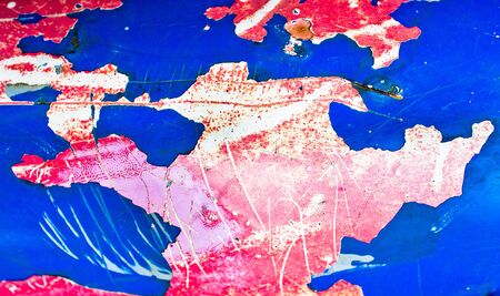 Peeling paint on a metal surafce as a background image