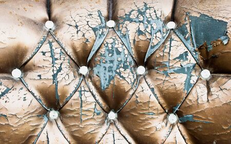 Close up of a worn antique chair coverの写真素材