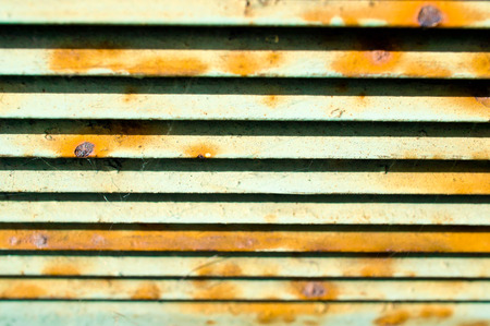 Part of a rusty metal ventilation panel, with selective focusの写真素材