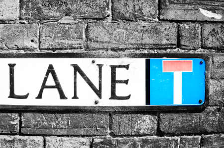 A place name sign with lane written on it, and a dead end symbolの写真素材