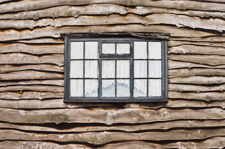 A window in a wooden cottageの写真素材