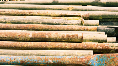 Stack of rusty metal bars as a backgroundの写真素材