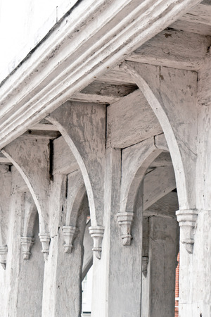 White painted wooden beams on an old english buildingの写真素材