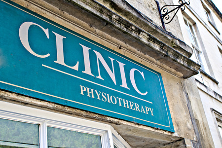 Part of a sign at a physiotherapy clinic in the UKの写真素材
