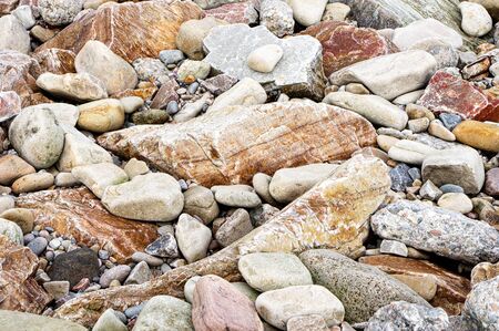 Rocks and stones on a beach as a background