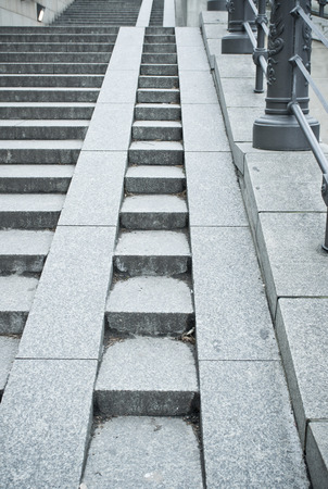 A set of stone steps in Germany with a ramp for wheelchairs and pushchairsの写真素材