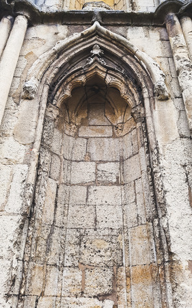 An arch alcove in a wall of a historic building in the UKの写真素材