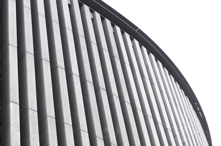 Part of a modern concrete building with a curved outline