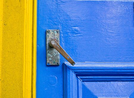 A blue door next to a yellow frameの写真素材