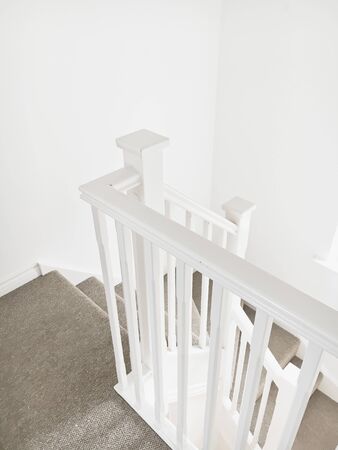 Part of a white wooden bannister in a modern homeの写真素材