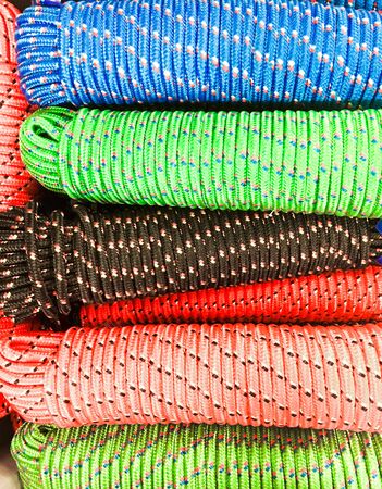 Bunches of colorful new rope as a backgroundの写真素材