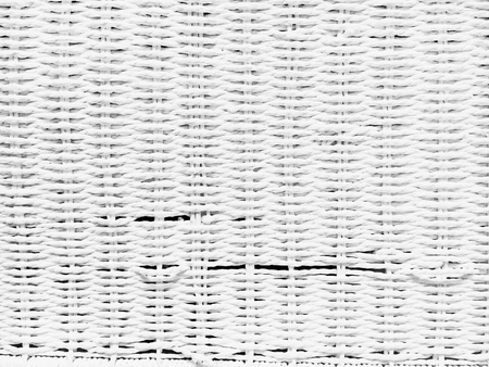 Part of a white rattan texture as a backgroundの写真素材