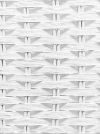 Part of a white rattan texture as a backgroundの写真素材