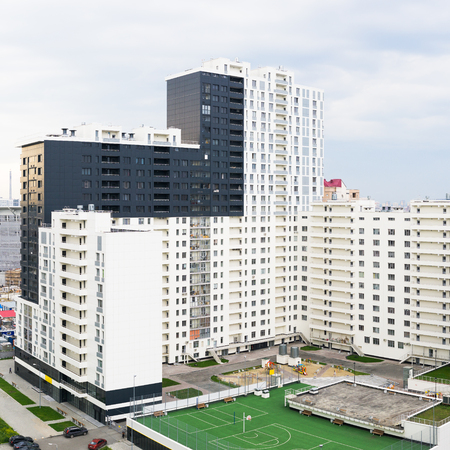 Yekaterinburg, Russia - August 01, 2017: Modern apartment house with a playground in the yardのeditorial素材