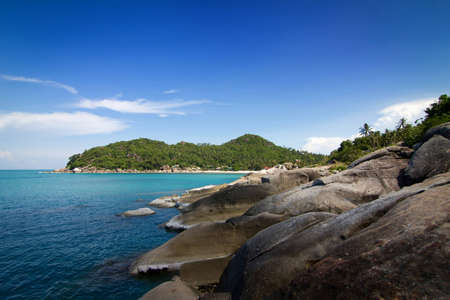 Stone coast and tranquil sea