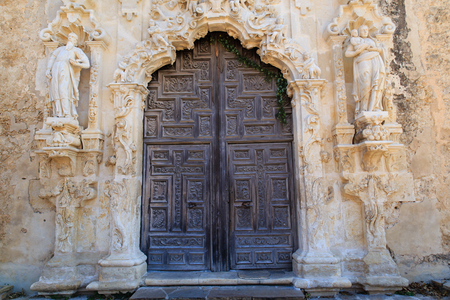 The intricately carved door at Mission San Josè in San Antonio, Texas, USA.の写真素材