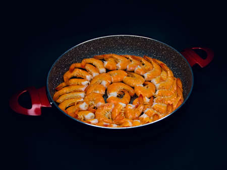 Fresh Mediterranean prawns in a pan on a black backgroundの写真素材