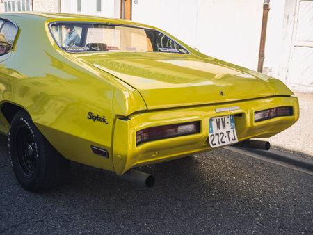 Loriol sur Drome, France - 17 September, 2022: Vintage yellow Buick Skylark, on the street. Classic car exhibition in Loriol sur Drome, France.のeditorial素材