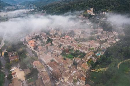 Panoramic view of the old village of Mirmande in France. Aerial photo in the morning in the thick...