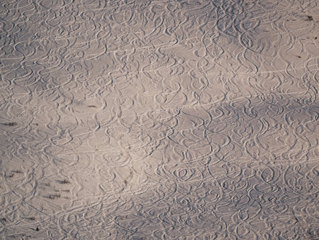 Slalom tracks in the snow on a mountainside in Alpe D'Huez ski resort - Franceの写真素材