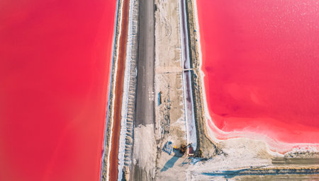 Aerial view of pink salt lake. Salt production plants evaporated brine pond in a salt lake. Salin de Giraud saltworks in the Camargue in Provence, South of Franceの写真素材