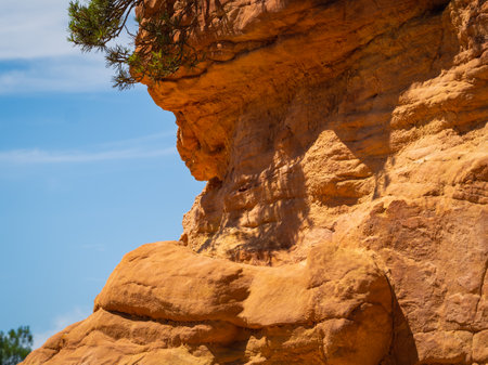 Abstract Rustrel canyon ocher cliffs landscape. Provencal Colorado near Roussillon, Southern France.