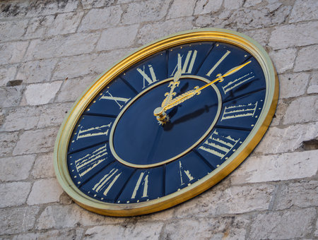 Clock on the wall of the old town in Prague, Czech Republic
