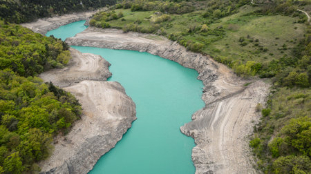 Scenic view of Lake Monteynard-Avignonet in a canyon in the French Alps near Grenoble, turquoise mountain lake surrounded by alpine peaks and forestsの写真素材